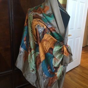 Oversized rectangular silk wrap.